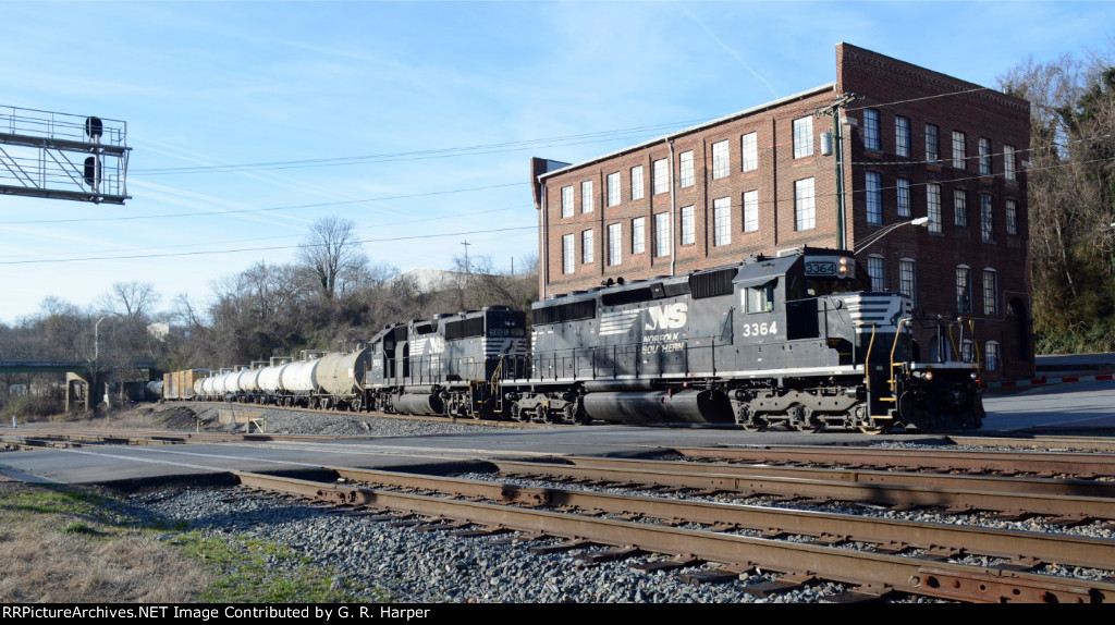 NS 3364 and NS 5801 bring the NS yard job E19 across Washington St.  Cut of cars for interchange with CSX trail